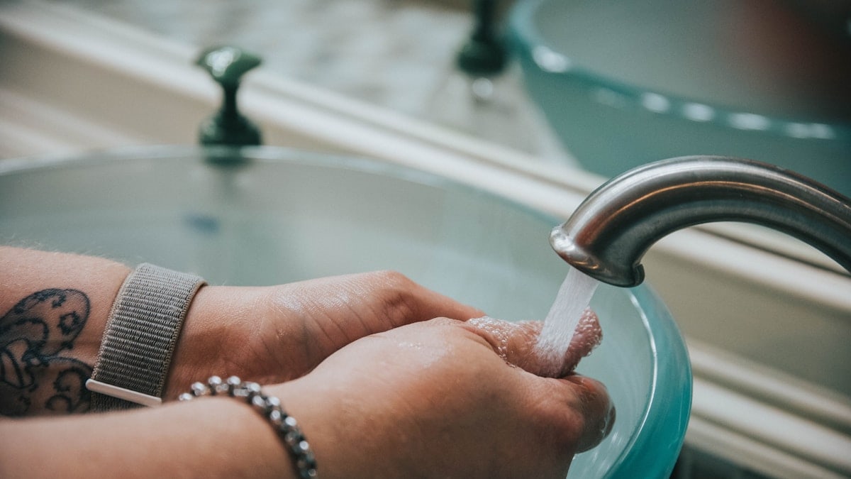 washing hand in a raised sink